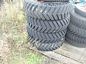 GOODYEAR 8.25-15 INDUSTRIAL TREAD SKID STEER TIRES ON BOBCAT WHEELS